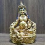 24K gold plated Dzambhala (Jambhala) statue, 22cm tall, handcrafted Buddhist wealth deity with intricate detailing, blue facial highlights, and ornate lotus pedestal base.