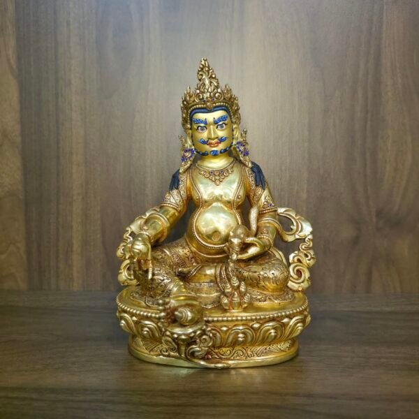 24K gold plated Dzambhala (Jambhala) statue, 22cm tall, handcrafted Buddhist wealth deity with intricate detailing, blue facial highlights, and ornate lotus pedestal base.