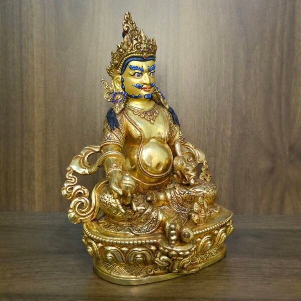 24K gold plated Dzambhala (Jambhala) statue, 22cm tall, handcrafted Buddhist wealth deity with intricate detailing, blue facial highlights, and ornate lotus pedestal base.