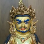 24K gold-plated Dzambhala (Jambhala/Zambala) statue, 17 cm tall, 13 cm base, 1.10 kg — handcrafted Buddhist wealth deity with blue facial highlights on an ornate lotus pedestal.