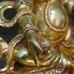 24K gold-plated Dzambhala (Jambhala/Zambala) statue, 17 cm tall, 13 cm base, 1.10 kg — handcrafted Buddhist wealth deity with blue facial highlights on an ornate lotus pedestal.