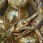 24K gold-plated Dzambhala (Jambhala/Zambala) statue, 17 cm tall, 13 cm base, 1.10 kg — handcrafted Buddhist wealth deity with blue facial highlights on an ornate lotus pedestal.