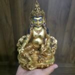 24K gold plated Dzambhala (Jambhala) statue, 22cm tall, handcrafted Buddhist wealth deity with intricate detailing, blue facial highlights, and ornate lotus pedestal base.