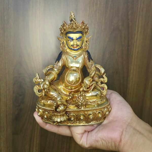 24K gold-plated Dzambhala (Jambhala/Zambala) statue, 17 cm tall, 13 cm base, 1.10 kg — handcrafted Buddhist wealth deity with blue facial highlights on an ornate lotus pedestal.