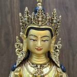 Close-up of Vajrasattva statue’s gold-powder painted face and five-leaf crown with gemstone inlay, 24K gold-plated copper.