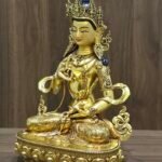 Right three-quarter view of Vajrasattva (Dorje Sempa) statue, 24K gold-plated copper with gem-set ornaments and flowing ribbon motifs.