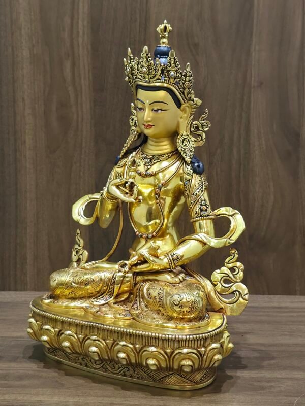 Right three-quarter view of Vajrasattva (Dorje Sempa) statue, 24K gold-plated copper with gem-set ornaments and flowing ribbon motifs.