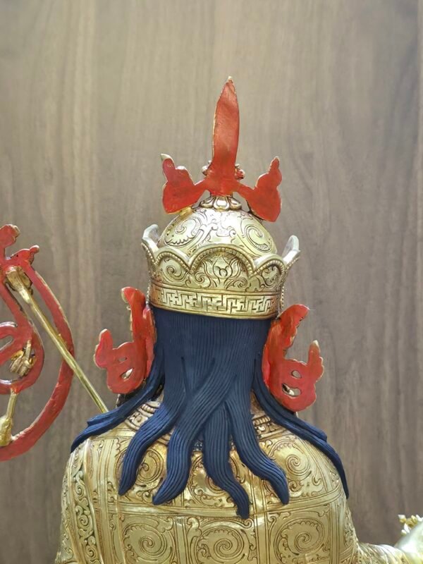 Detail shot of the back of Guru Rinpoche's lotus hat and crown, highlighting the 24K gold plating and hand-painted details.