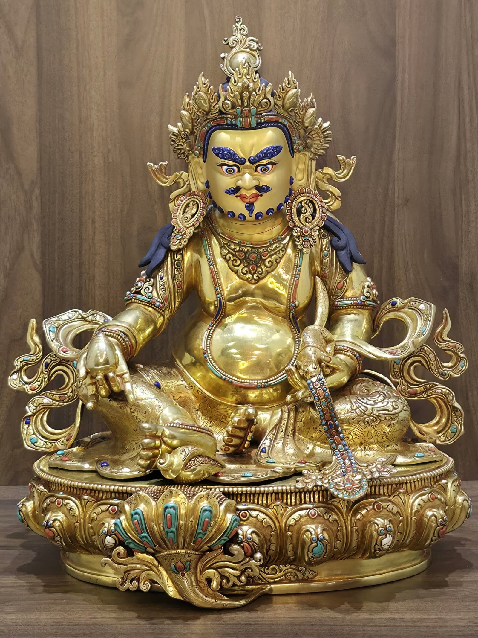 Large Yellow Dzambhala (Jambhala) statue — 24K gold-plated copper, gold-powder painted face, gemstone inlay (turquoise, red coral, lapis, conch), mongoose and citron on lotus base.