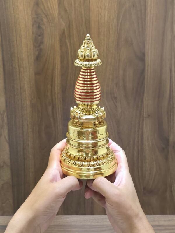 Hand-held size reference photo of gold plated Tibetan stupa chorten, 23cm