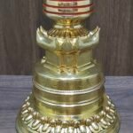 Close-up of stupa lower base with lotus petal band and carved detailing in gold-plated copper.