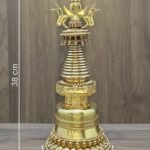 Gold plated copper Tibetan style Buddhist stupa with size overlay showing 38 cm height, 15 cm width, and 2.7 kg weight.