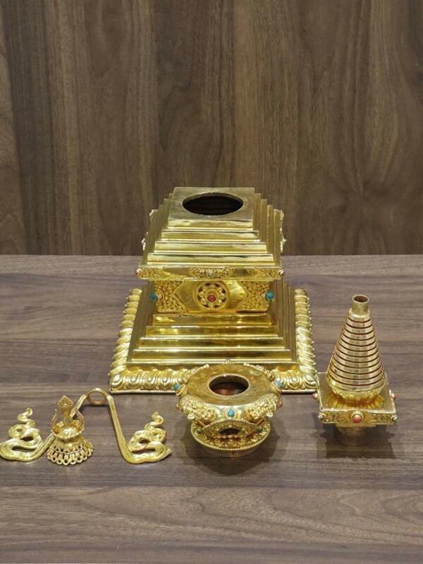 Stupa shown disassembled with separate sections laid out, revealing hollow openings for filling and assembly parts.