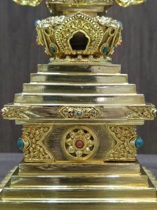 Straight on view showing the central decorative panel on the base and the upper section with arched niche detail.