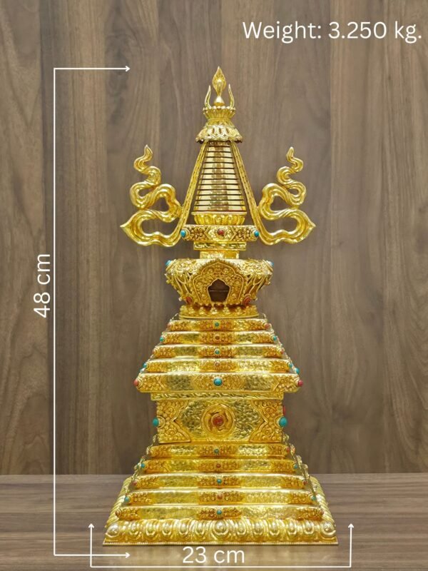 Straight on full view of the gold plated Tibetan style stupa with measurement labels showing 48 cm height, 23 cm width, and 3.250 kg weight on a wood background.