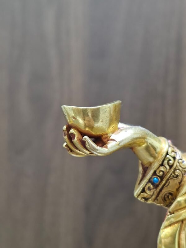 Close-up view of the Kapala (skull cup), held in the hand of the of the Yeshe Tsogyal statue.