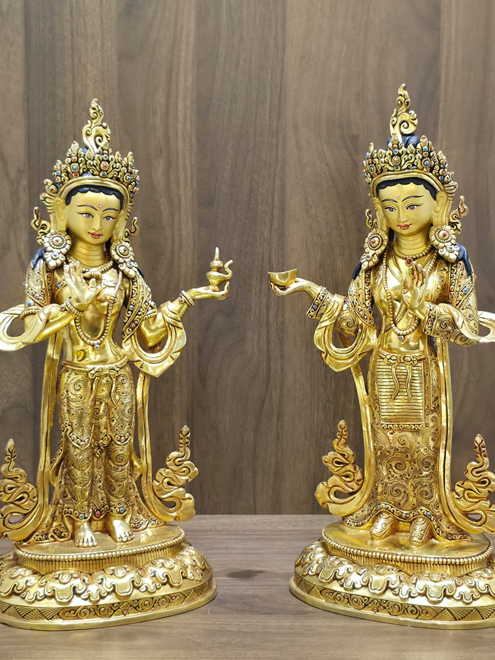 GW01-4:3-14 Set of two 35cm 24K gold plated statues of Guru Rinpoche consorts Mandarava and Yeshe Tsogyal facing each other on lotus bases.