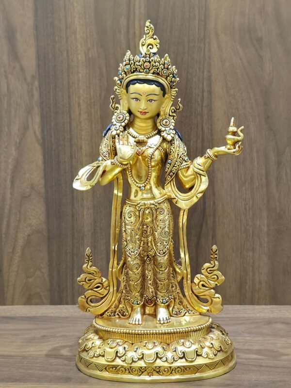 Front view of gold plated Mandarava statue, standing gracefully on a lotus base.