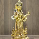 Left-side profile of the gold-plated Mandarava sculpture, highlighting her swaying posture and Bodhisattva jewelry.