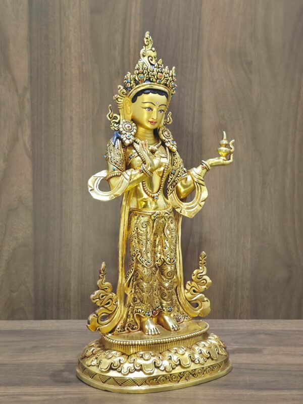 Left-side profile of the gold-plated Mandarava sculpture, highlighting her swaying posture and Bodhisattva jewelry.