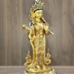 Left side angle of 24K gold plated Yeshe Tsogyal statue displaying a serene, hand-painted face.
