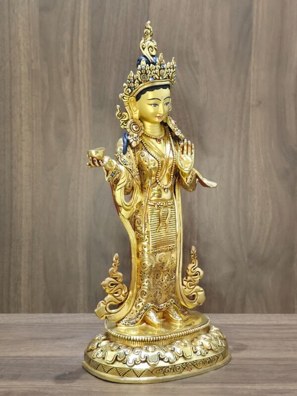 Left side angle of 24K gold plated Yeshe Tsogyal statue displaying a serene, hand-painted face.