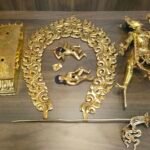 Flat lay showing the fully disassembled parts of the master quality Vajrayogini statue, including the lotus base, flaming aura, main body, khatvanga staff, and prostrate figures.