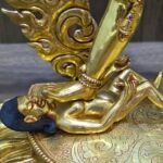 Artisanal detail of the lotus base and the worldly deities beneath the feet of the gold plated Vajrayogini.