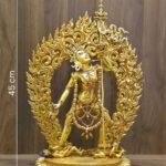 Front view of the gold Vajrayogini statue with dimensions indicated: 45 cm height, 25 cm width, and a weight of 4.310 kg.