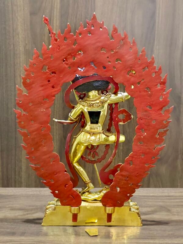Back view of Dorje Phagmo Vajravarahi statue showing red painted reverse of the halo and rear figure details on the base.