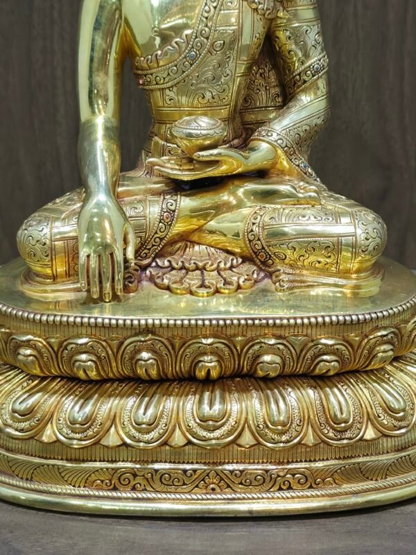 Detailed shot of the double lotus throne and base of the statue, featuring precise metalwork and a high-lustre gold finish.