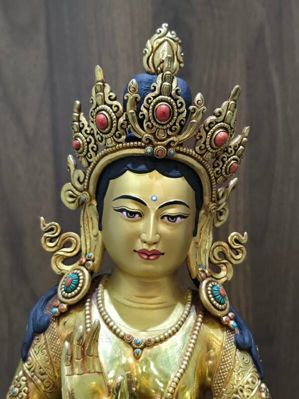 Extreme close-up of Mandarava face, meticulously hand-painted with pure gold powder on the warm copper base.