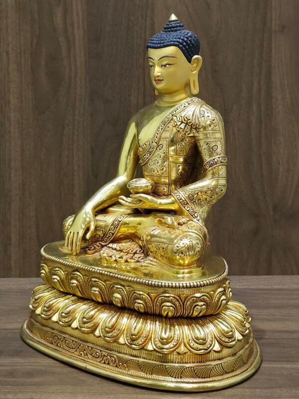 Right angled view of Shakyamuni Buddha statue with earth touching gesture on lotus throne.